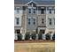 Charming townhome exterior featuring a mix of siding and brick accents, complimented by a neatly landscaped front yard at 4223 S New Hope Rd # 8, Cramerton, NC 28032