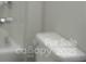 Out of focus bathroom view of a white toilet and sink with silver fixtures at 4225 S New Hope Rd # 9, Cramerton, NC 28032