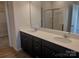 Bathroom featuring a double sink vanity and a full-sized mirror and a glass shower at 4225 S New Hope Rd # 9, Cramerton, NC 28032