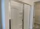 Bathroom features a shower with sliding glass doors and wire shelving at 4225 S New Hope Rd # 9, Cramerton, NC 28032