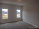 This bedroom offers neutral carpeting and walls for a modern and comfortable feel at 4225 S New Hope Rd # 9, Cramerton, NC 28032
