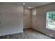 Bright entryway featuring wood-look flooring, a white door, and a window at 4225 S New Hope Rd # 9, Cramerton, NC 28032
