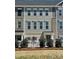 New townhouse with gray siding, brick accents, and a charming white picket fence at 4225 S New Hope Rd # 9, Cramerton, NC 28032