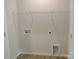 A well-lit laundry room with connections and a wire rack provides efficient space for laundry tasks at 4225 S New Hope Rd # 9, Cramerton, NC 28032