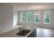 Open living space with lots of windows for natural light, adjacent to the kitchen at 4225 S New Hope Rd # 9, Cramerton, NC 28032
