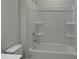 Bathroom with white bathtub and shower combination and sleek chrome fixtures. Toilet in the foreground at 4229 S New Hope Rd # 11, Cramerton, NC 28032