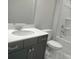 Bathroom featuring a sleek vanity with a white countertop, gray cabinets, modern sink, and toilet at 4229 S New Hope Rd # 11, Cramerton, NC 28032