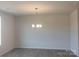 Dining room with modern light fixture and neutral paint at 4229 S New Hope Rd # 11, Cramerton, NC 28032