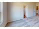 Comfortable bedroom features plush carpet, a doorway to a bathroom, and a glimpse of an upstairs hallway at 4227 S New Hope Rd # 10, Cramerton, NC 28032