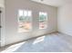Bright bedroom with carpet, two windows, and neutral walls, creating a calm and inviting space at 4227 S New Hope Rd # 10, Cramerton, NC 28032