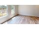 Bright bedroom featuring beautiful hardwood floors, large windows offering plenty of natural light, and neutral wall colors at 4227 S New Hope Rd # 10, Cramerton, NC 28032