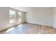 Bright bedroom with wood-look floors and large windows offering great natural light and peaceful views at 4227 S New Hope Rd # 10, Cramerton, NC 28032