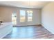 Inviting dining area with wood-look floors, natural light, and modern chandelier, great for entertaining at 4227 S New Hope Rd # 10, Cramerton, NC 28032
