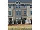 Charming townhome featuring gray siding, brick accents, and manicured landscaping in a friendly neighborhood at 4227 S New Hope Rd # 10, Cramerton, NC 28032