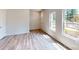 Bright living room featuring wood-look flooring and natural light from windows, creating a welcoming space at 4227 S New Hope Rd # 10, Cramerton, NC 28032