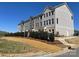 Row of modern gray townhomes featuring clean lines and manicured landscaping in a neighborhood setting at 4227 S New Hope Rd # 10, Cramerton, NC 28032