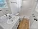 Clean bathroom with white vanity, neutral flooring, and walk-in shower at 1006 Wilson Blvd, Dallas, NC 28034
