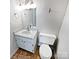 Bathroom with a sink, toilet, a large mirror and modern fixtures at 1006 Wilson Blvd, Dallas, NC 28034