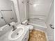 Bathroom with tub, shower, toilet, sink, and a large mirror with modern fixtures at 1006 Wilson Blvd, Dallas, NC 28034