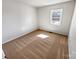 Bedroom featuring neutral carpet, white walls, and natural light from a window at 1006 Wilson Blvd, Dallas, NC 28034
