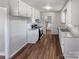 Bright kitchen featuring white cabinets, modern appliances, and vinyl floors at 1006 Wilson Blvd, Dallas, NC 28034