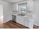 Kitchen with stainless steel appliances, white cabinets, and a view to the backyard at 1006 Wilson Blvd, Dallas, NC 28034