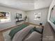 Bright main bedroom with plush bed, modern decor, and two large windows at 1006 Wilson Blvd, Dallas, NC 28034