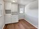 Mud room featuring white cabinets, a countertop, and a door leading to the backyard at 1006 Wilson Blvd, Dallas, NC 28034