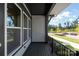 Cozy outdoor balcony with black metal railing, offering views of the lawn and street at 413 Prine Pl # Brx0014, Charlotte, NC 28213