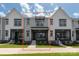 New construction townhome with gray siding, covered entry, and black trim at 413 Prine Pl # Brx0014, Charlotte, NC 28213
