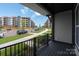 View from the covered porch showcases the neighborhood street at 413 Prine Pl # Brx0014, Charlotte, NC 28213