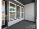 View of the covered porch entry through the front door windows at 413 Prine Pl # Brx0014, Charlotte, NC 28213