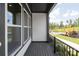 Balcony with black metal railing, exterior siding, and a view of the street at 417 Prine Pl # Brx0013, Charlotte, NC 28213