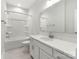 Bathroom with white cabinets, quartz countertops, tile floors, and shower-tub combo at 417 Prine Pl # Brx0013, Charlotte, NC 28213