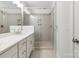 Bathroom featuring marble countertops, a sink, and glass shower at 417 Prine Pl # Brx0013, Charlotte, NC 28213