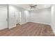 Bedroom featuring wood floors, ceiling fan, closet, ensuite bathroom, and natural lighting at 417 Prine Pl # Brx0013, Charlotte, NC 28213