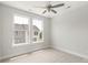 Bedroom with a view, carpet, and two large windows at 417 Prine Pl # Brx0013, Charlotte, NC 28213