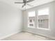 Bedroom with light-colored walls, carpet, ceiling fan, and two large windows at 417 Prine Pl # Brx0013, Charlotte, NC 28213