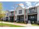 New construction townhome with white board and batten and dark trim at 417 Prine Pl # Brx0013, Charlotte, NC 28213