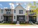 Modern townhome with a well-maintained front yard and neutral color scheme at 417 Prine Pl # Brx0013, Charlotte, NC 28213