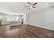 Open-concept living room and kitchen with hardwood floors and ample natural light at 417 Prine Pl # Brx0013, Charlotte, NC 28213