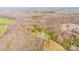 A vast aerial view capturing the home nestled in a dense forest at 166 Rosalind Ln, Statesville, NC 28677