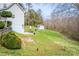 Spacious backyard with a shed, patio, outdoor furniture, and wooded perimeter at 166 Rosalind Ln, Statesville, NC 28677
