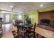 The dining set is placed near a brick fireplace in the finished basement of this beautiful home at 166 Rosalind Ln, Statesville, NC 28677