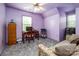 This bedroom features unique furnishings, a desk, and an attractive purple color scheme at 166 Rosalind Ln, Statesville, NC 28677