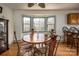 Kitchen nook featuring wood table, view windows, and ample seating at 166 Rosalind Ln, Statesville, NC 28677