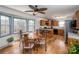 Eat-in kitchen featuring wood cabinets, stainless steel appliances, and a round wooden table with chairs at 166 Rosalind Ln, Statesville, NC 28677