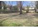 Large backyard with grassy area and mature trees at 431 E 12Th Ave, Gastonia, NC 28054