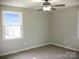 Bright bedroom with ceiling fan and neutral wall colors at 431 E 12Th Ave, Gastonia, NC 28054