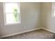 Spacious bedroom with a large window and neutral decor at 431 E 12Th Ave, Gastonia, NC 28054